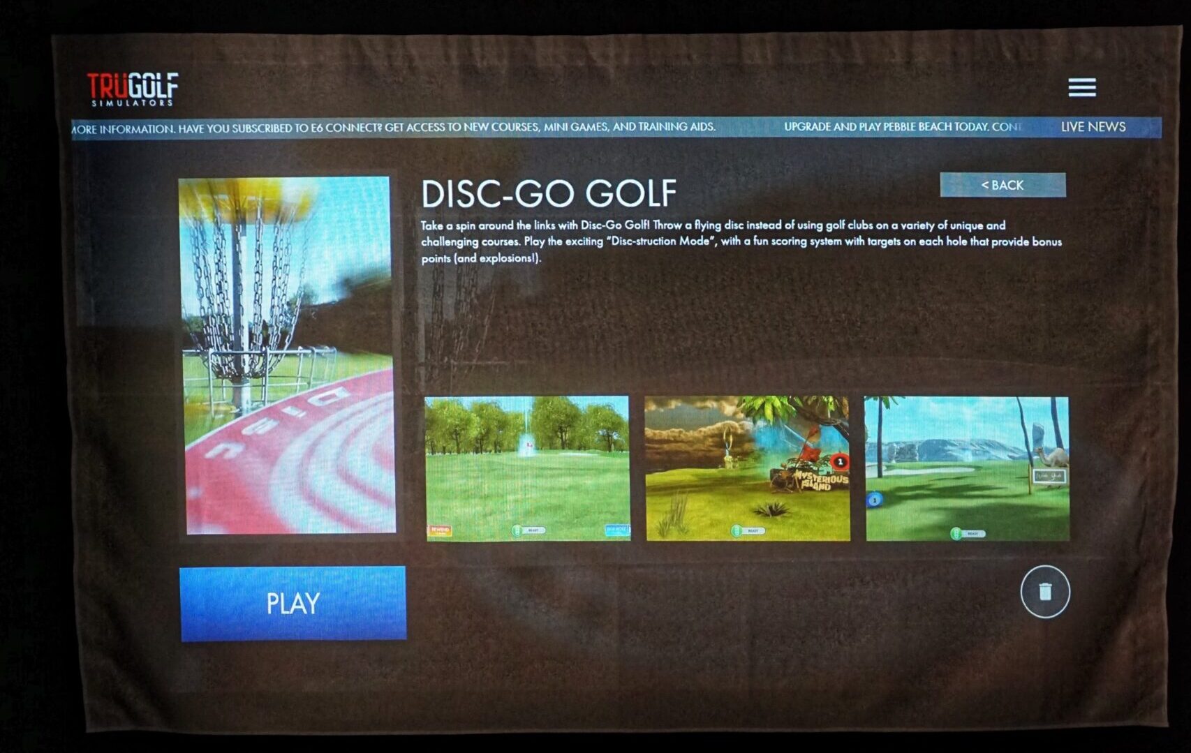Disc golf simulator game screen displaying a virtual disc golf course with a player aiming for a distant target